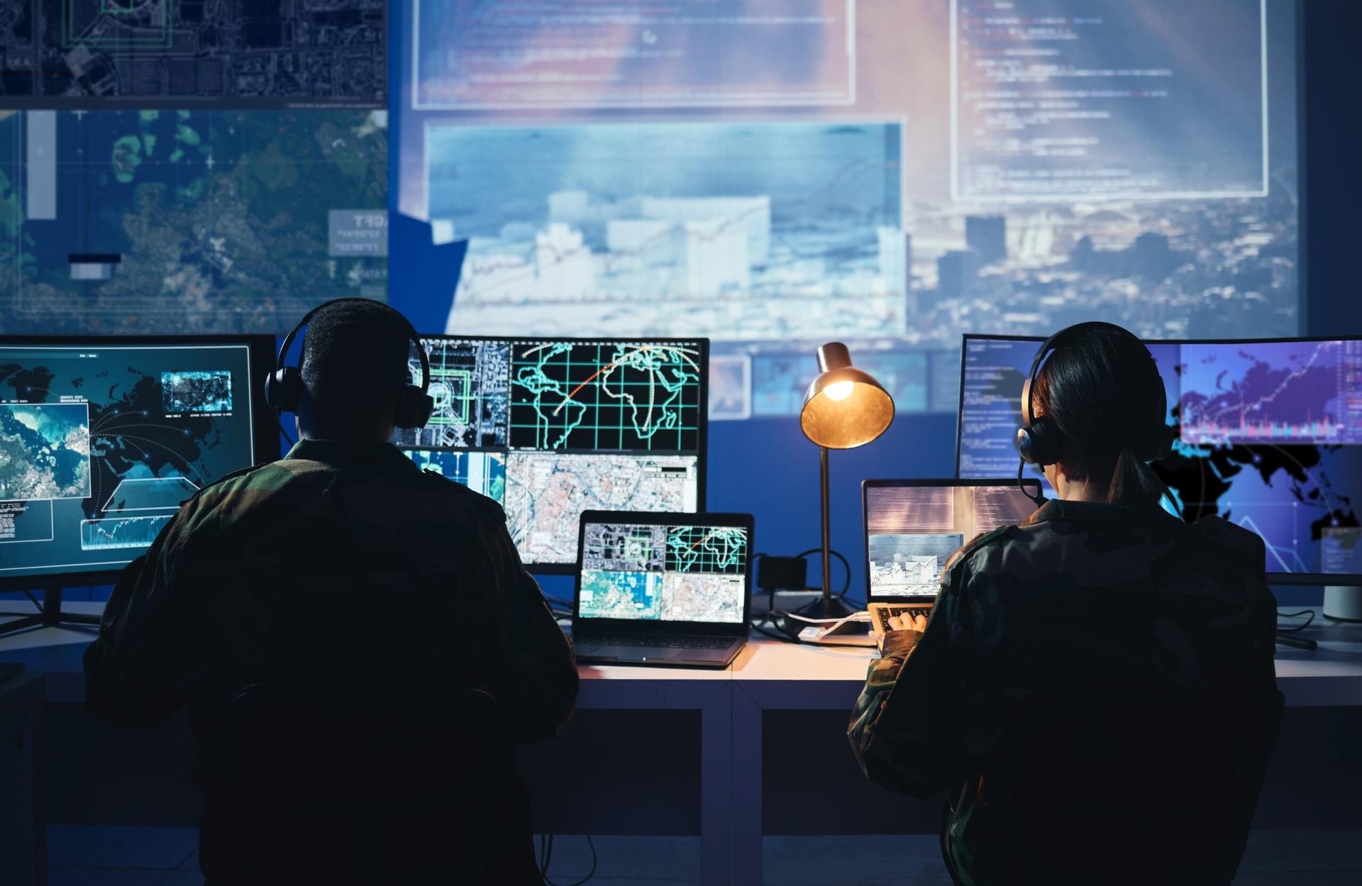 Security operations center analysts monitoring live surveillance feeds